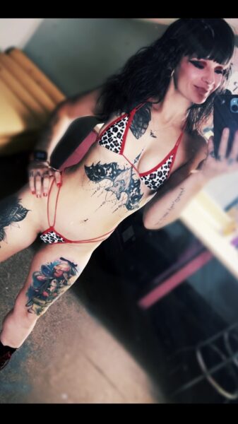 Spearmint Rhino Pittsburgh entertainer with tattoos and red bikini, view profile.